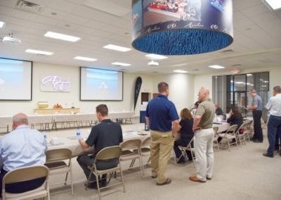 Business meeting with presentations in a conference room.