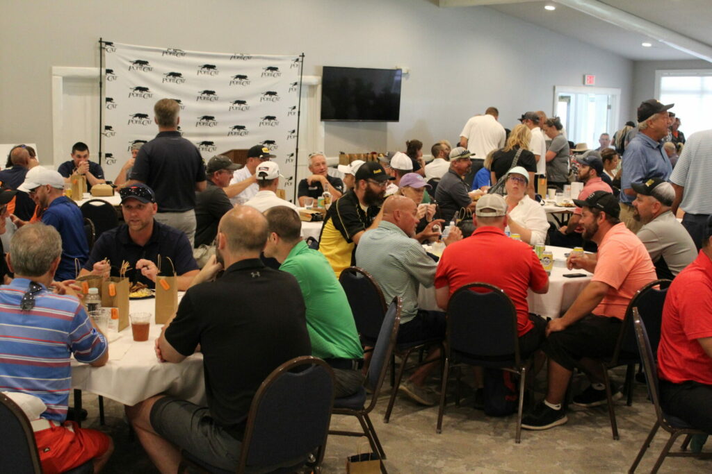 People socializing at a large indoor event.