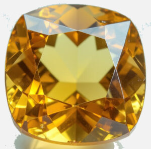 Faceted yellow citrine gemstone close-up