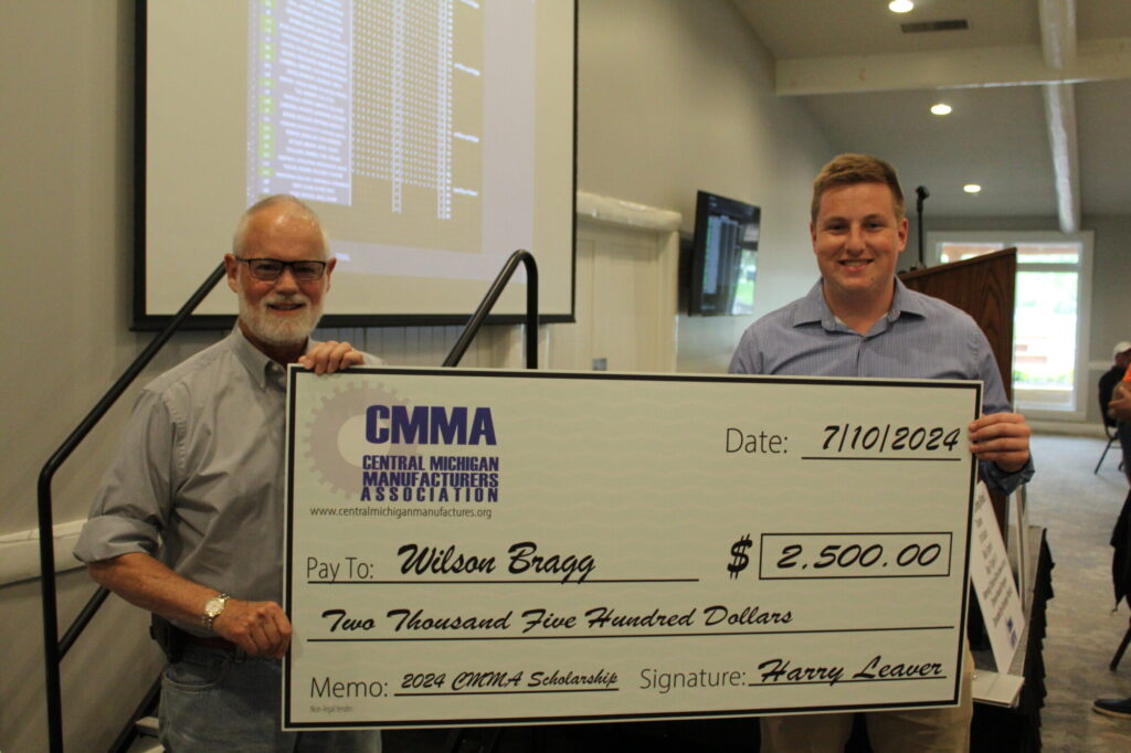 CMMA awards $2500 scholarship check to recipient.