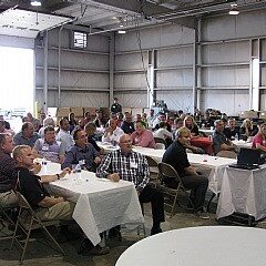 Group attending a seminar in an industrial space.